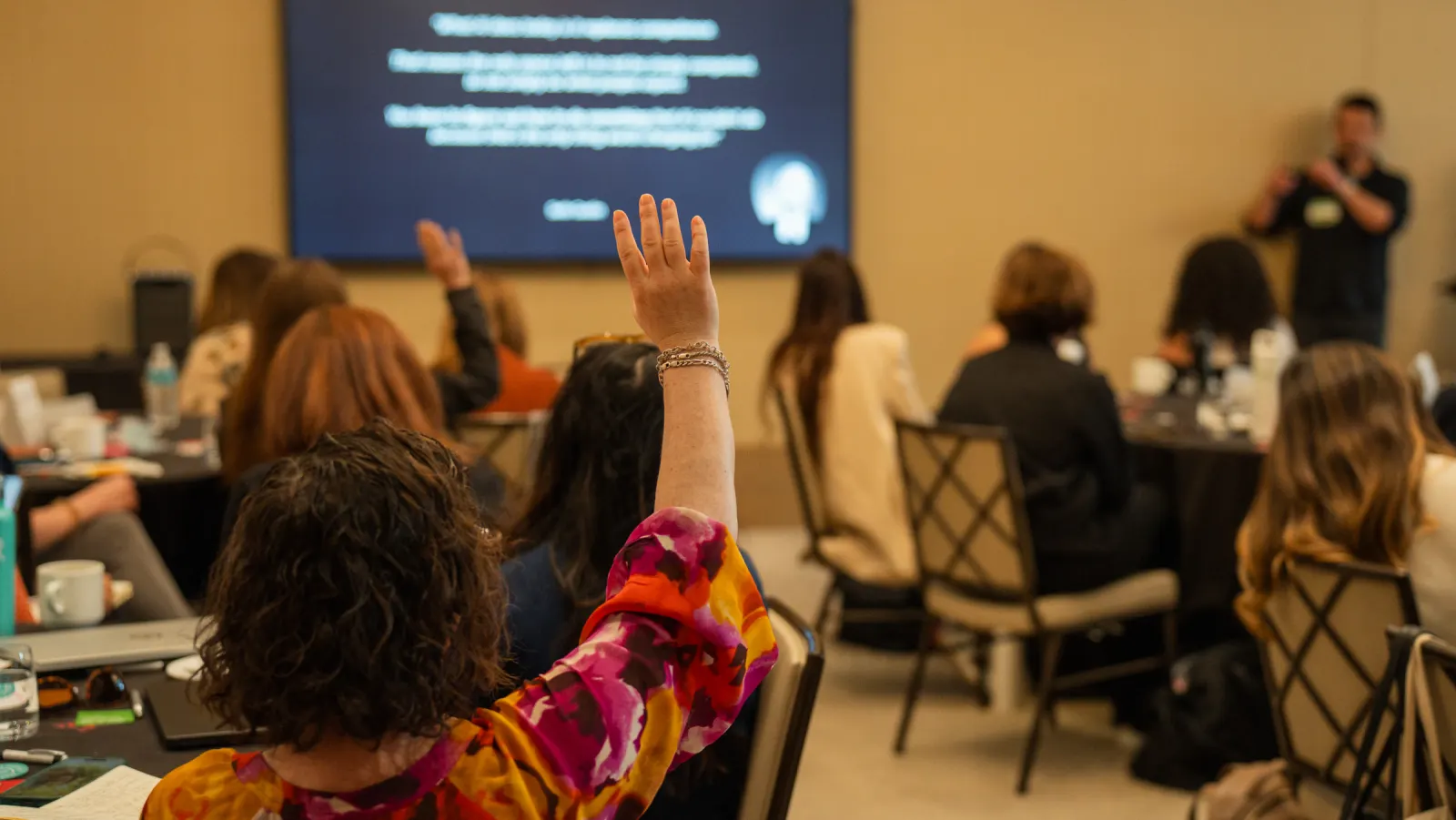 FFN members raising hands during a Member Summit session
